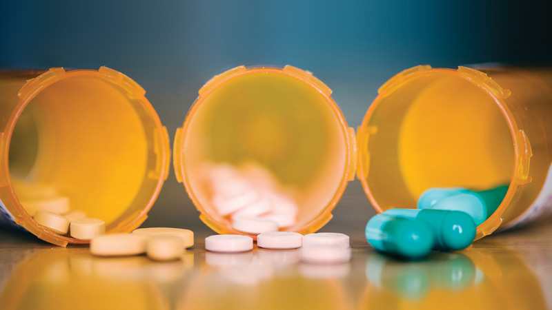 caixas de medicamentos com comprimidos